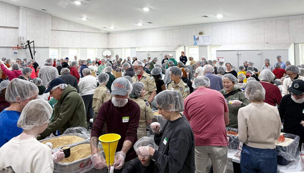 Community packing meals for Rise Against Hunger MLK Day 2026